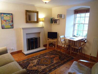 Living room (with double sofabed) with dining area